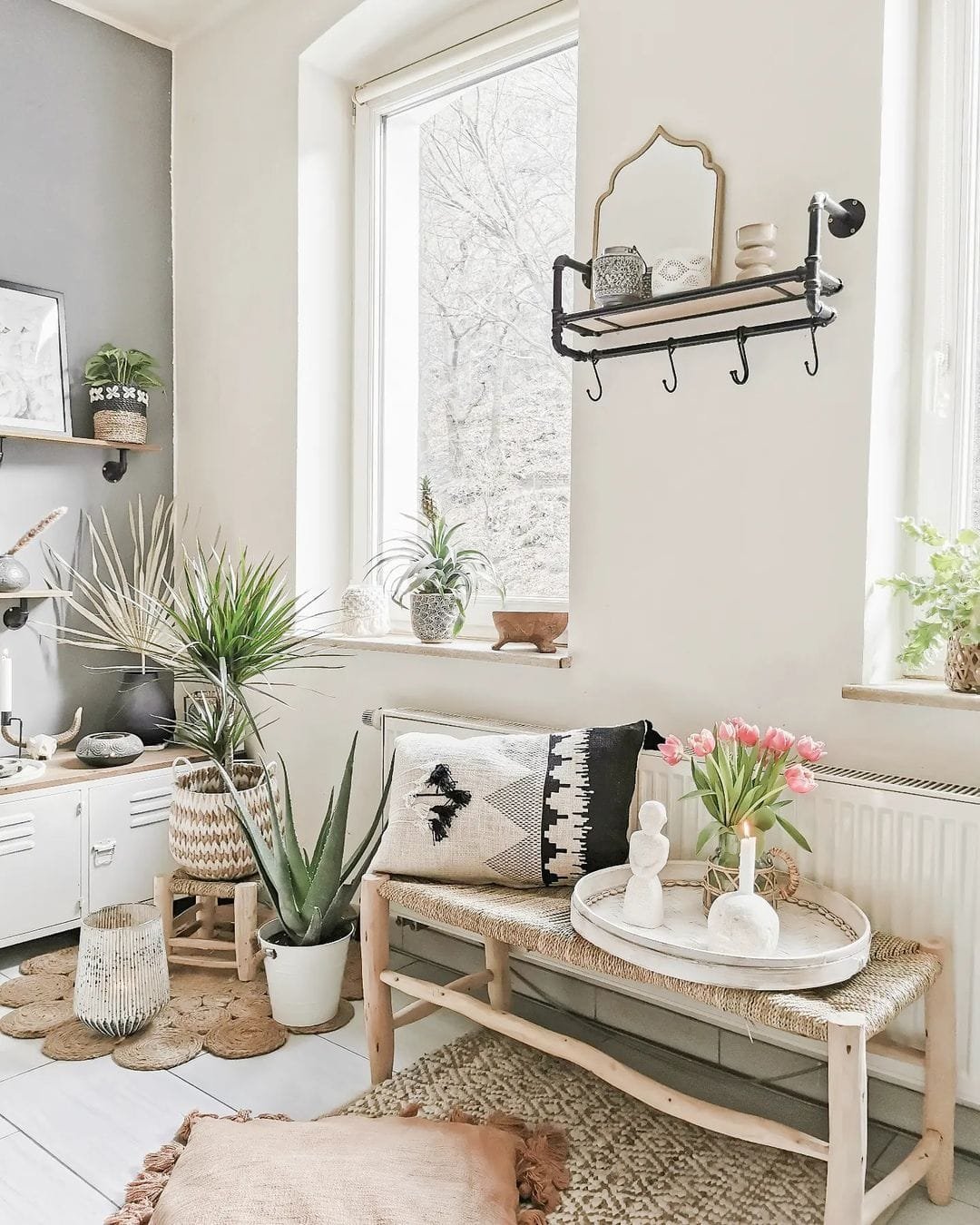 use different flower pots, woven rugs, a wooden bench and throw pillow to add a mix of textures, colors, and patterns to your decor.
