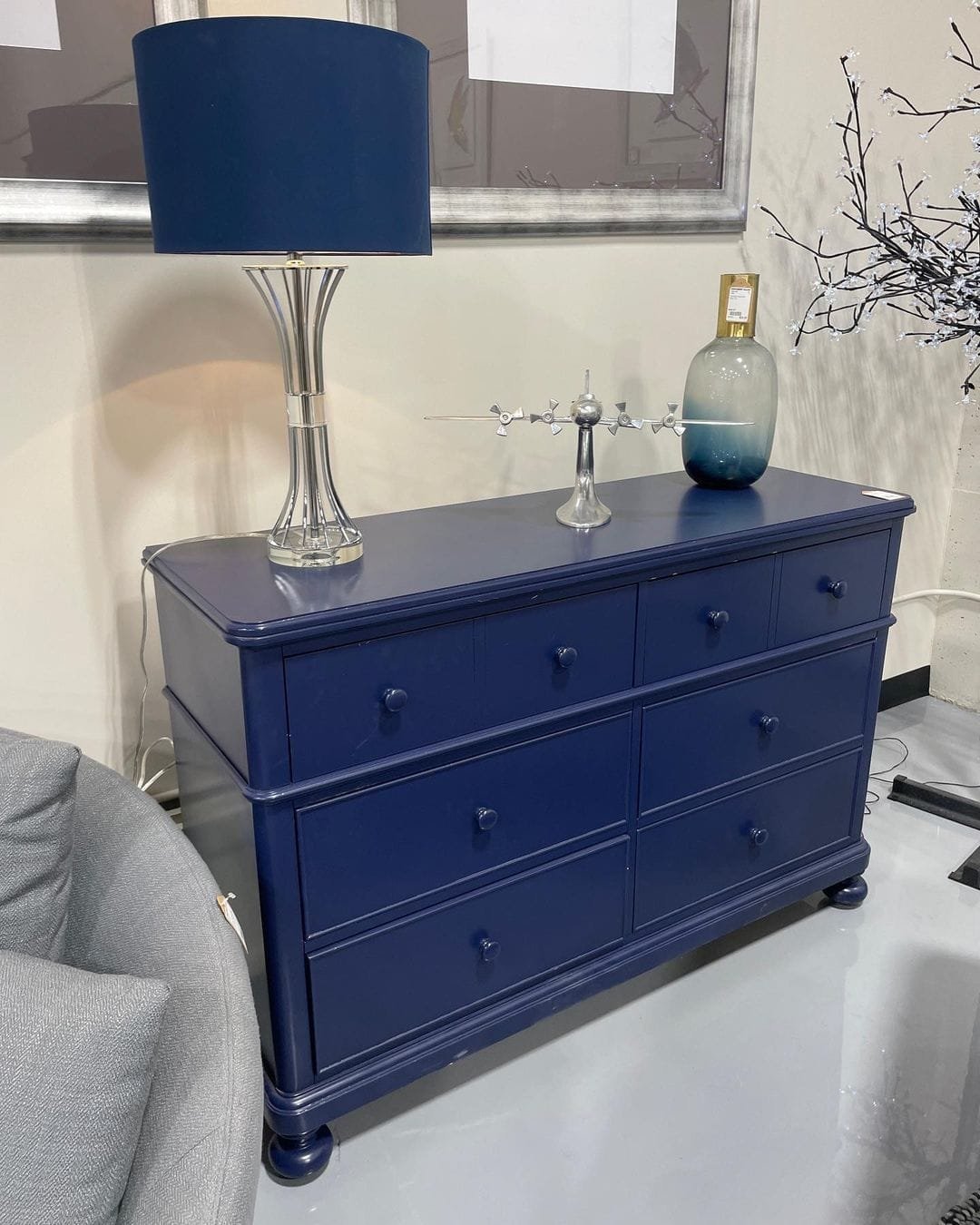repurposing an old dresser to use for storage is a clever way to reuse an existing item and is an efficient alternative to buying a new item.