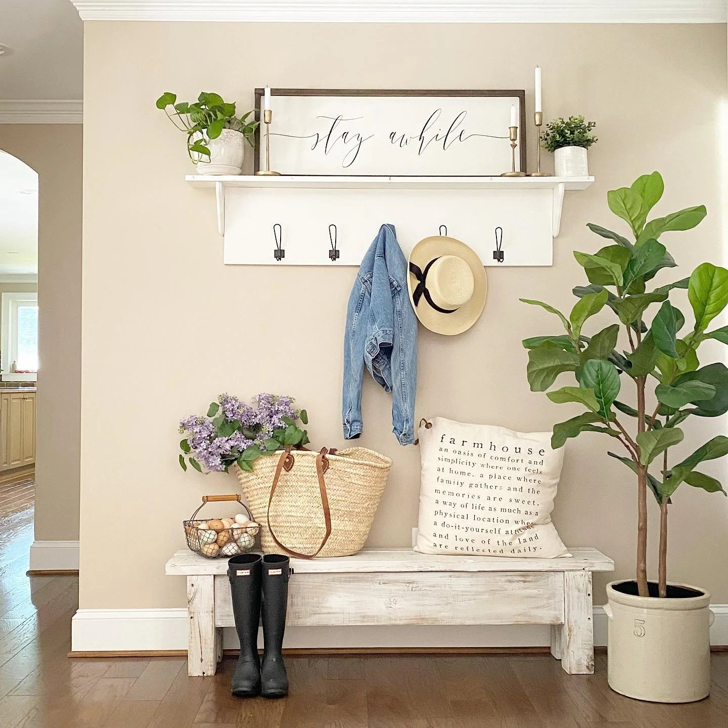 Create your own mudroom with a coat rack and plant on the wall for a touch of summer home decor.
