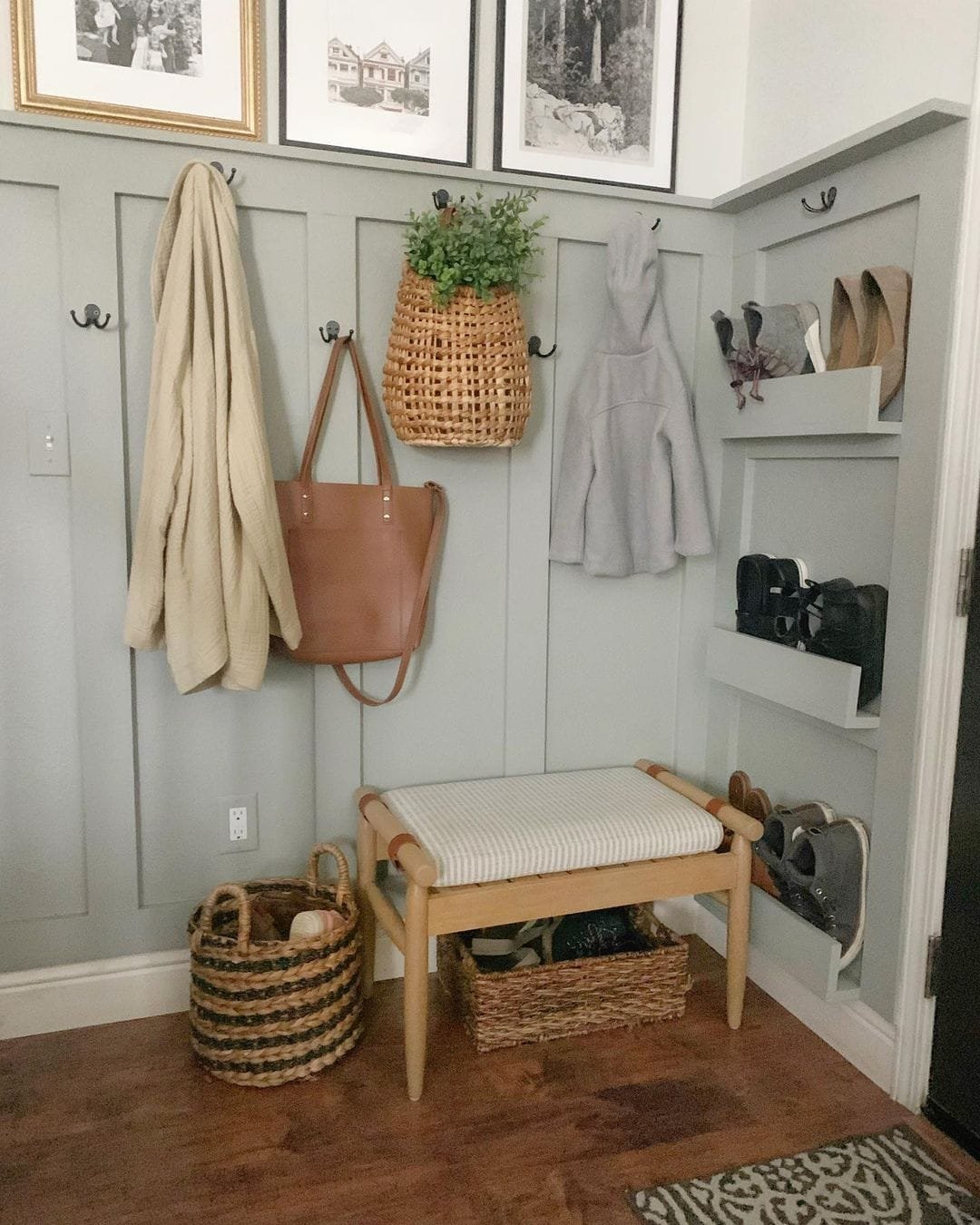 using wall hooks and open shelving to store clothes, bags, and shoes is an efficient use of wall space while staying organized.