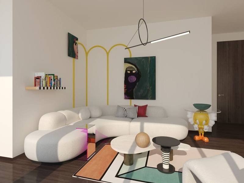 Funky living room with white modular sofa, modern art on walls, a multicolored rug, and funky lighting fixture.