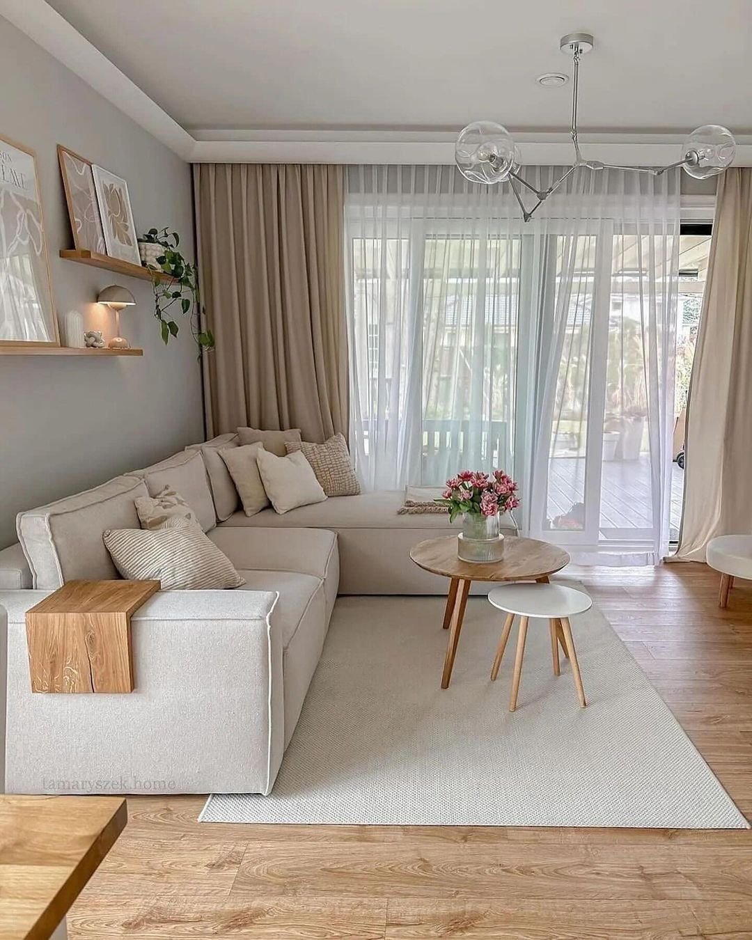 large window and door with layered curtains make this living room look warmer with more flexibility