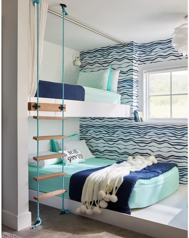 A bunk bed in a room adorned with beach decor, thoughtfully selecting colors and materials for a serene coastal vibe.