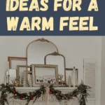 A rustic farmhouse mantel decorated with layered vintage mirrors, natural greenery, red and white garland, candles, and cozy accents for a warm and inviting winter look.